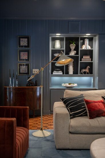 The living room’s richness starts with “Eclipse” by Benjamin Moore.