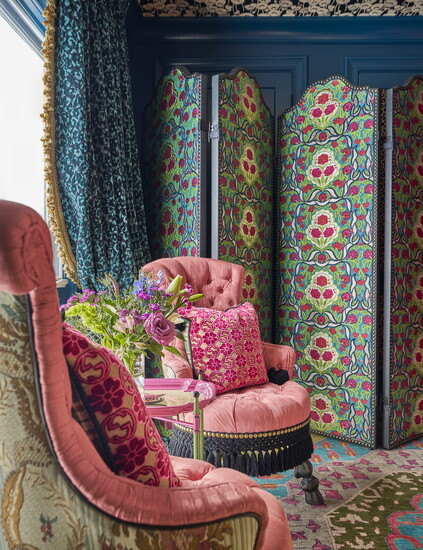 This page: Both the velvet cheetah drapery and the flocked cheetah wallpaper in the armoire are from Romo Fabrics. Opposite page: The walls are painted in 