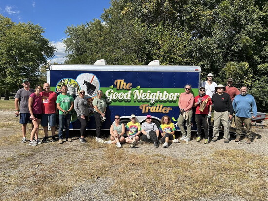 Acting Up volunteers with the Good Neighbor Trailer at their fall clean up. 