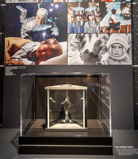 Images of children in toy space gear help young visitors imagine what it felt like to grow up during the Space Race.
