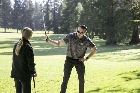 Ben Richards giving a golf lesson