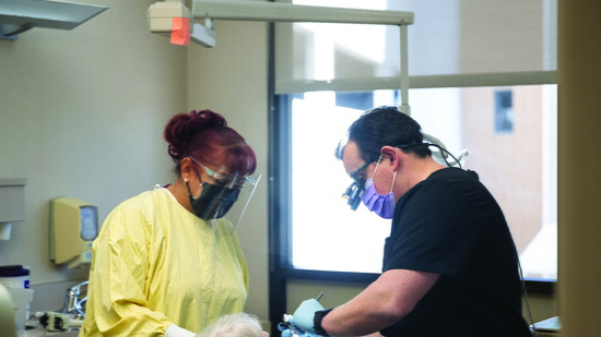 Dr. Will Grella providing care to a patient.