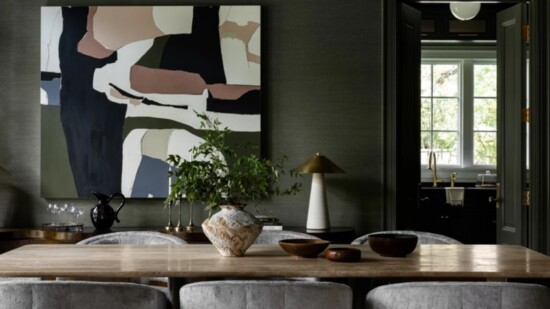 Deep, rich color on walls and ceiling along with dramatic lighting are popular in dining rooms in large luxury homes, such as this one by Erin Stetzer Homes.