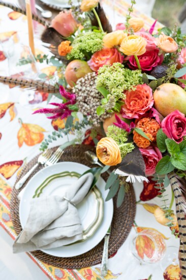 Kevin Coble of Le Fleur added fruits, vegetables and feathers to the arrangement to create a autumnal look.