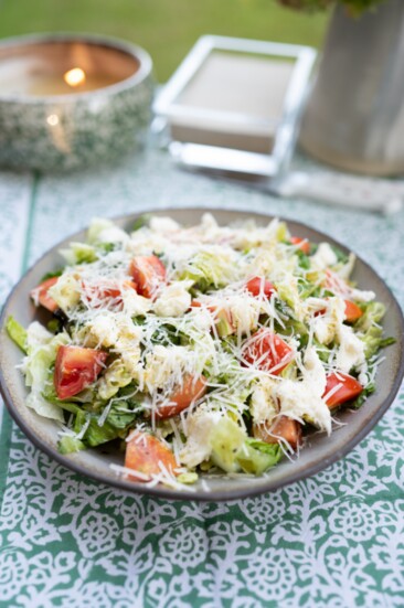 To Start: Grilled Romaine Salad topped with tomato, pesto vinaigrette and fresh mozzarella.