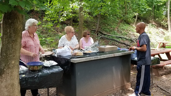 “Tic Tock’s Grove” where volunteers serve lunch and our guests enjoy their meals. 