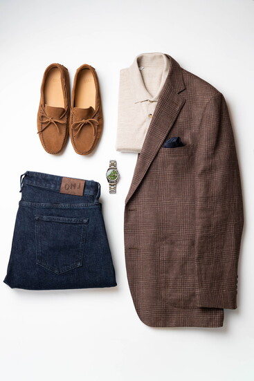 Items pictured from OMJ (Most garments are made-to-measure, and pricing varies): Knit polo, $225. Sports coat, $995. Denim, $325. Driving Shoe, $295. Watch,
