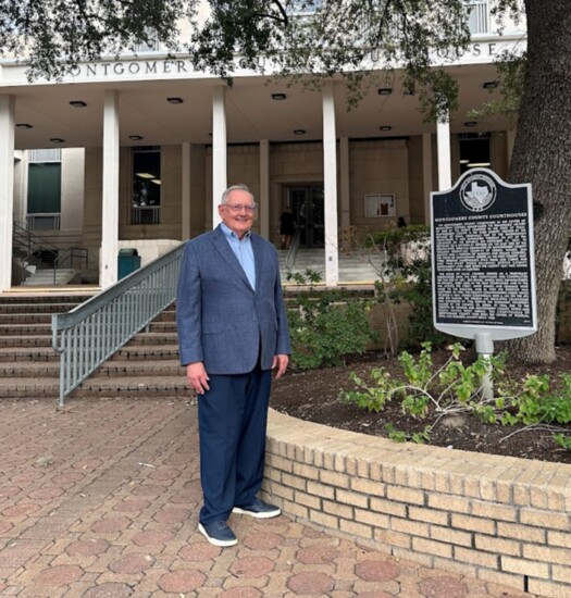 Representing the Montgomery County Historical Commission, Larry Foerster stands in front of the Montgomery County Courthouse. Photo-Kimberly Sutton