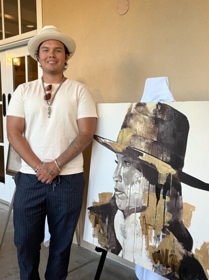 Artist George Alexander and one of his paintings