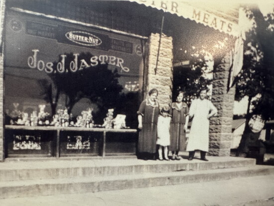 J.J Jaster and his family outside the grocery in the early years