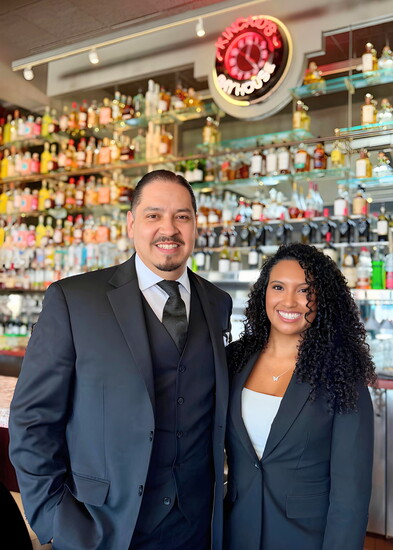Isbhak Vazquez and Janee Funderburk welcome guests to Kincaid's bar and lounge, where Happy Hour is served exclusively Monday through Friday from 3 to 6 PM.