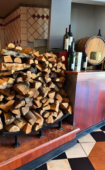 Almond wood adds a distinctive layer of flavor to Kincaid’s signature grilled dishes.