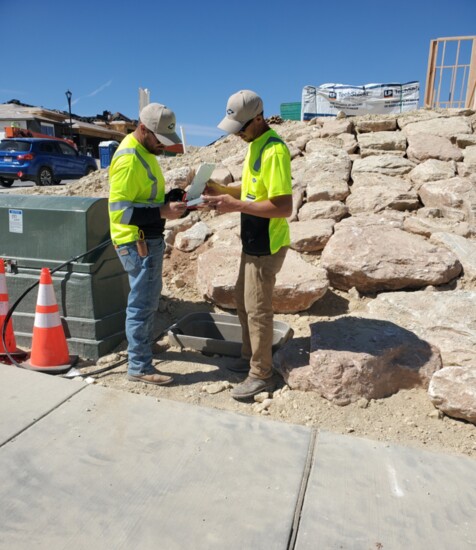 TDS Field Service Technicians, Justin Hearring and Jordan Peterson, discuss a fiber-to-home project