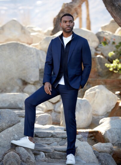 Layering up! Navy tonal Flexo check suit, blue wool double zip knit, white Henley shirt, and white sneakers.