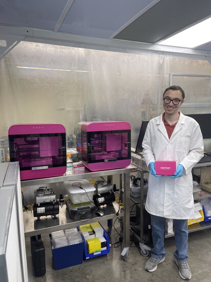 Daniel Benzel working with a Rastrum bioprinter that can be used for personalized medicine-based drug screening.