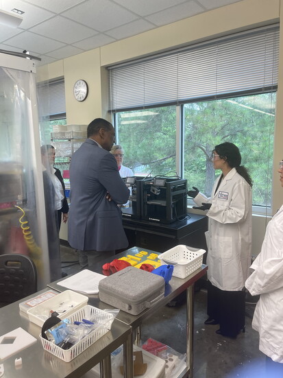 Rileigh Rinaudo speaking with Congressman Burgess Owens about a student project. 