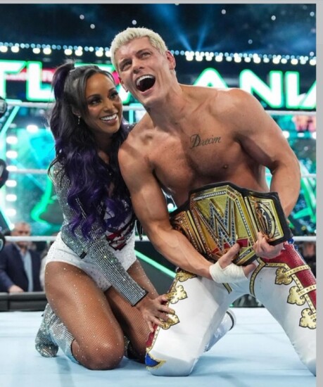 Brandi and Cody celebrate in the ring upon victory