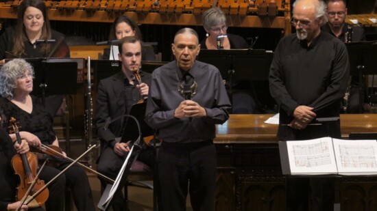 Composer Jerod Tate speaks to the audience at a Norman Philharmonic’s American Heritage concert prior to a performance of Iholba' Vision).