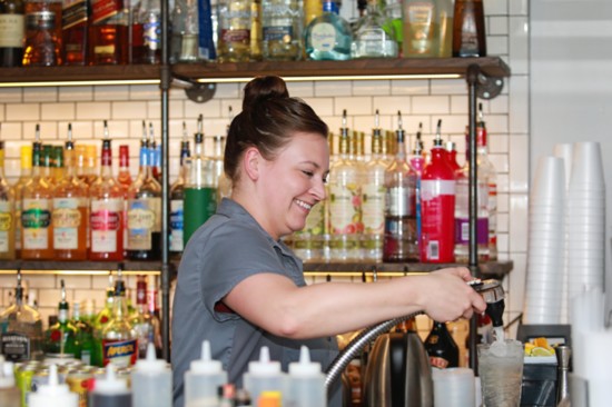 Morgan Brantner, bartender at the Greens Country Club, whips up a Club Special.