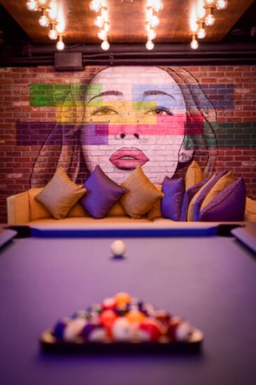 A pool table and mural are featured in one of the two private rooms available in the OKC Tap House.