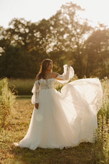 From dreamy billowy sleeves to classic strapless cuts and delicate botanical lace—discover the soft, effortless gown that brings your fairytale to life