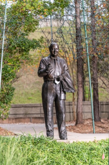 The George P. Mitchell life-size bronze, located in Town Green Park