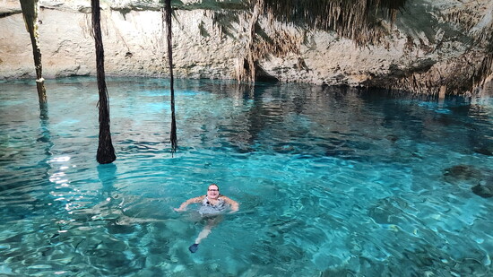 swimming in a Cenote (naturally formed pool)in Mexico