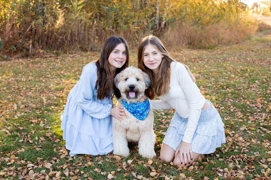 Their daughters with their dog, Chewy. Photo by Luanne Sliva.