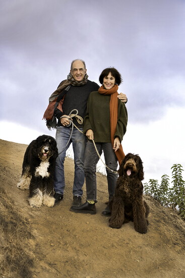 Kahn with her husband, Anthony Foux, and their two dogs