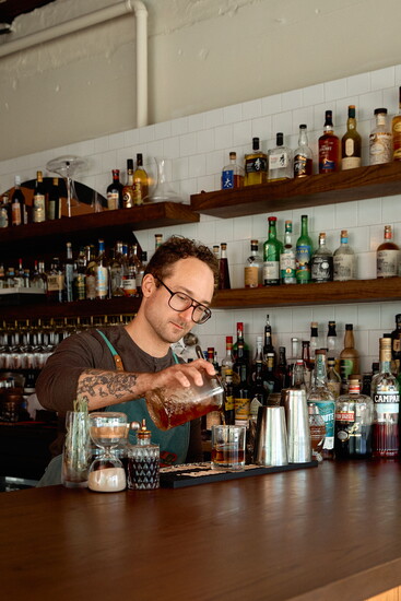 Luc Olsen behind the bar.