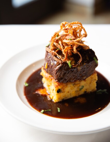 Chile Citrus Glazed Short Rib Over House Made Corn And Zucchini Pudding, Frizzled Onions