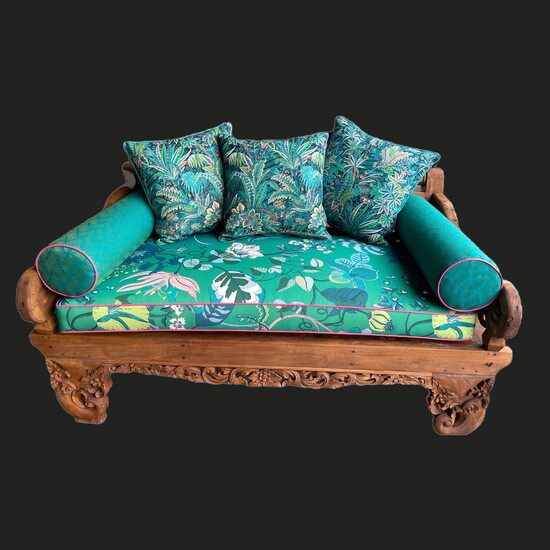 One of our more playful projects, this outdoor chaise was upholstered in vibrant shades of emerald and cobalt from Liberty of London, bringing bold color and re