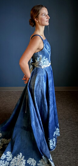 Kate Allen wearing the dress she created using cyanotype
