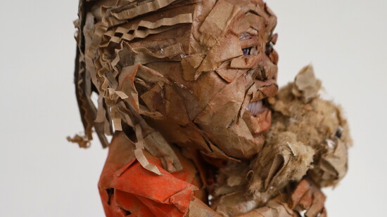 Smile, a cardboard sculpture made by Omotola (Tola) Oladeji