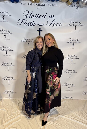Marianne and her daughter, Maggie, attending the elegant Catholic Charities Ball.