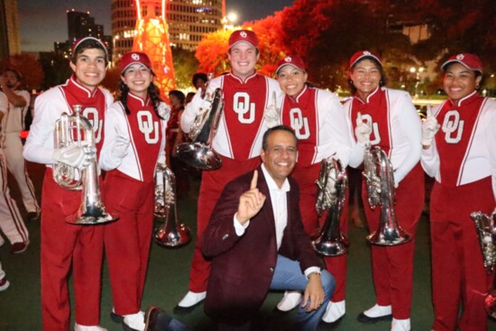 OU President Joseph Harroz Jr. poses with members of the band.