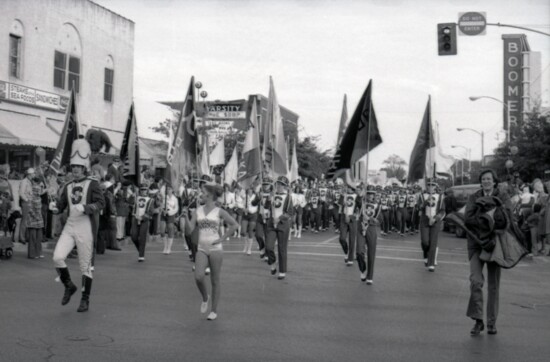 The Pride marches down Asp Avenue on Campus Corner, circa 1982-84. (Courtesy Western History Collections)