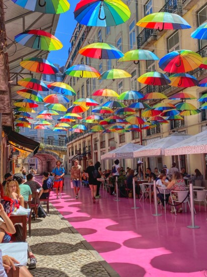 Umbrellas lining a street in Downtown Lisbon.