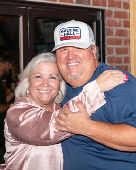 Wendy Navarro and Andy Gilley share a moment during the reopening of Jolly Ollie's.