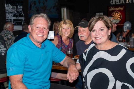 Jeff and Kathleen Hawkins share a table with Jill Steier and Don Claussen during the reopening of Jolly Ollie's. 