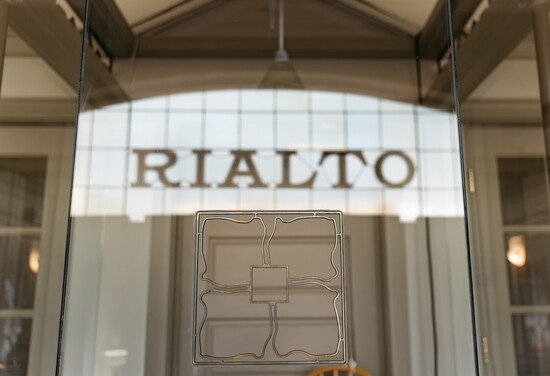 The dogwood flower logo of the Rialto Theater near the theater's front entrance