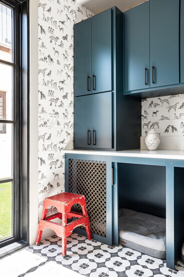 Custom cabinetry keeps leashes, treats, towels and grooming supplies organized and within easy reach. 