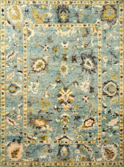 This 100% wool pile rug, hand-knotted by artisans in India brings a touch of antique beauty into any home. 