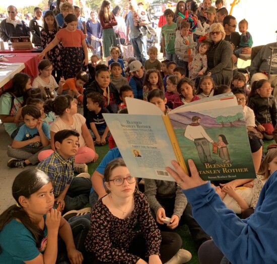 Susan Rother Bond's children's book is read to a rapt audience of children and adults