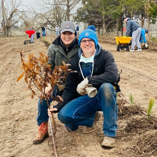 Sue Rother Bond and her husband, Dr. James Bond, plant trees on the site of the Blessed Stanley Rother Shrine, scheduled for completion in July 2022