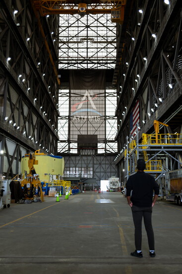Joshua Dobbs takes in NASA’s Vertical Assembly Building (VAB), and the history towers overhead. The same building that prepared Apollo and Shuttle missions