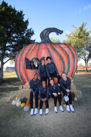 OU Women's Basketball team at a Halloween-themed Wings Special Needs Community partnership event (Photography by Phinina Corey)