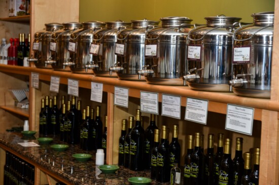 Containers called fustis hold olive oils and balsamic vinegars.