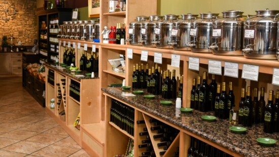 Containers called fustis hold olive oils and balsamic vinegars.