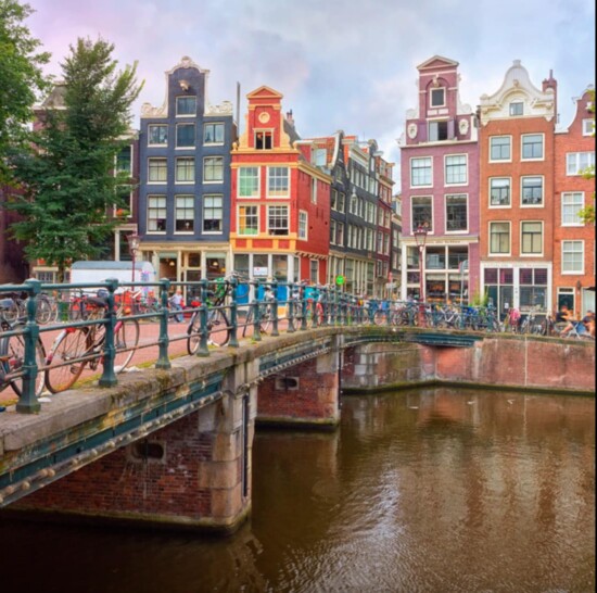 An iconic bridge and colorful row houses in Amsterdam. 